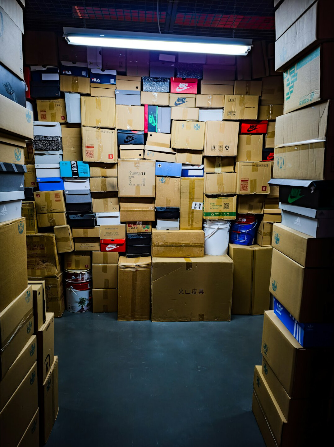 Rows of legal archive boxes and public records in a records room