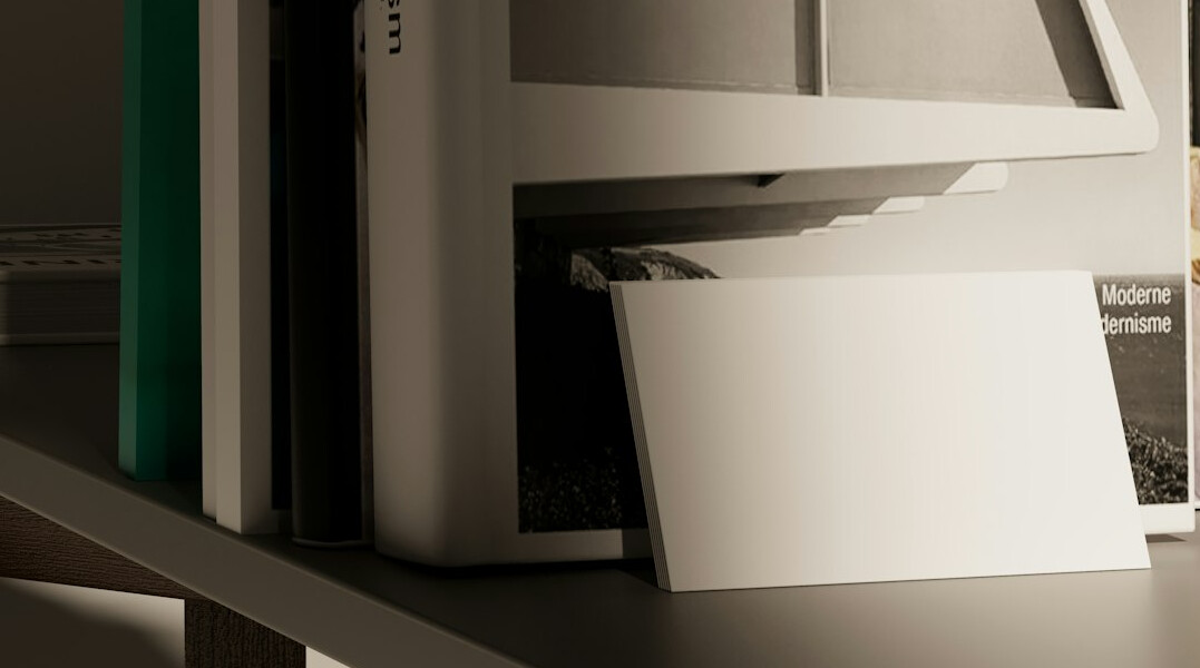 Journalist cross-referencing printed documents at a desk